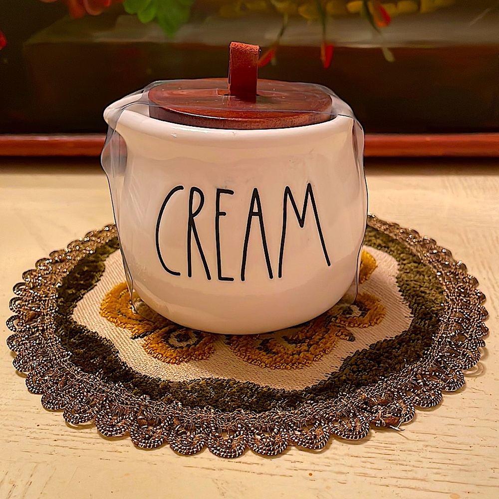 Rae Dunn CREAM ceramic creamer with wooden top with leather loop holder.